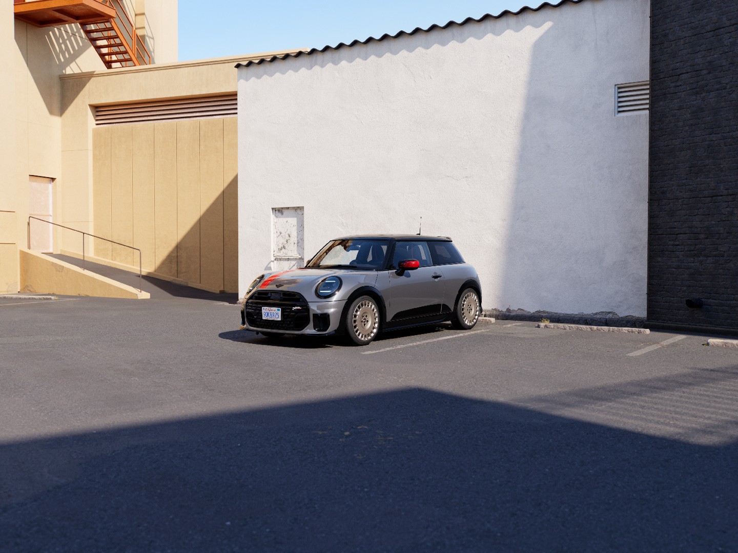 MINI Convertible in Silver boasting sporty JCW styling products including MINI JCW mirror caps, sport stripes and winglet.